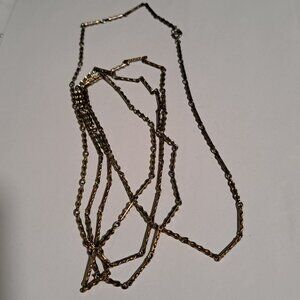 Long gold and silver tone necklace made up of small segments